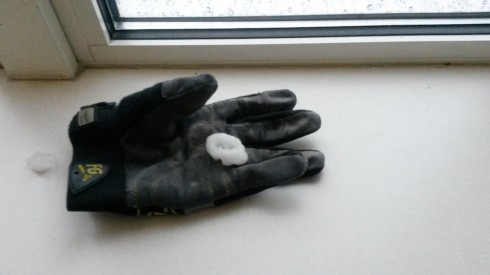 Hailstone with a glove for scale.