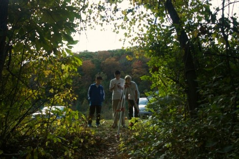 Measuring the distance down to the creek.