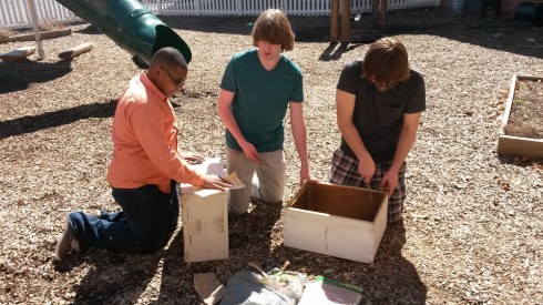 Students also scraped the insides of the hives to remove old comb material. 