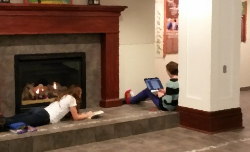 Working by the fireplace.