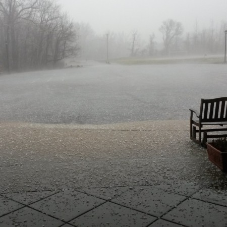 Hail falls on the back porch.