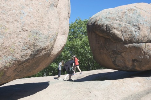 Students explore the massive, spheroidally weathered boulders at Elephant Rocks State Park.